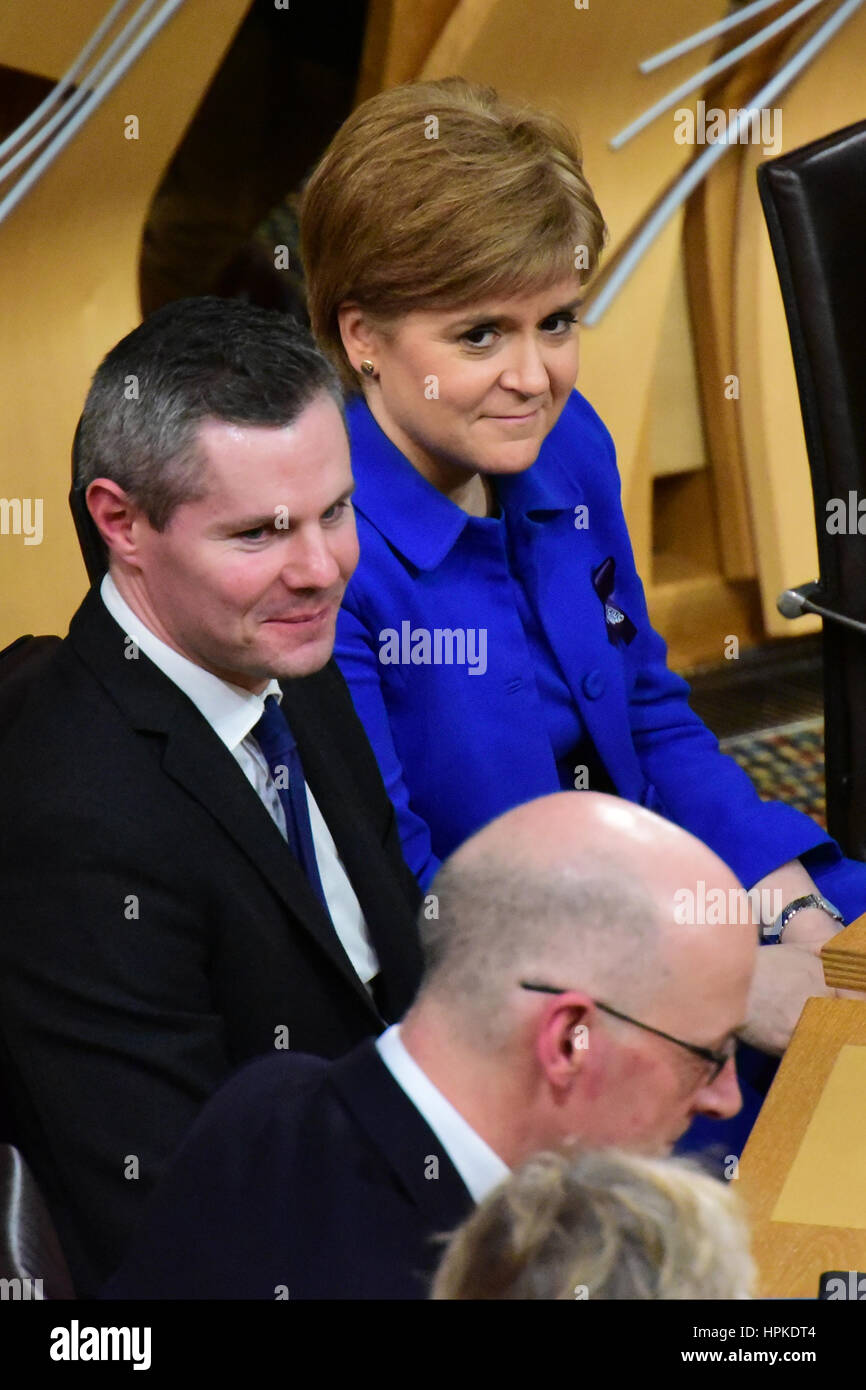 Edinburgh, Scotland, United Kingdom. 23rd February, 2017. Scottish Finance Secretary Derek Mackay (L), First Minister Nicola Sturgeon, and Deputy First Minister John Swinney await the result of the vote on the final stage of the Scottish budget, which the Government finally carried, Credit: Ken Jack/Alamy Live News Stock Photo