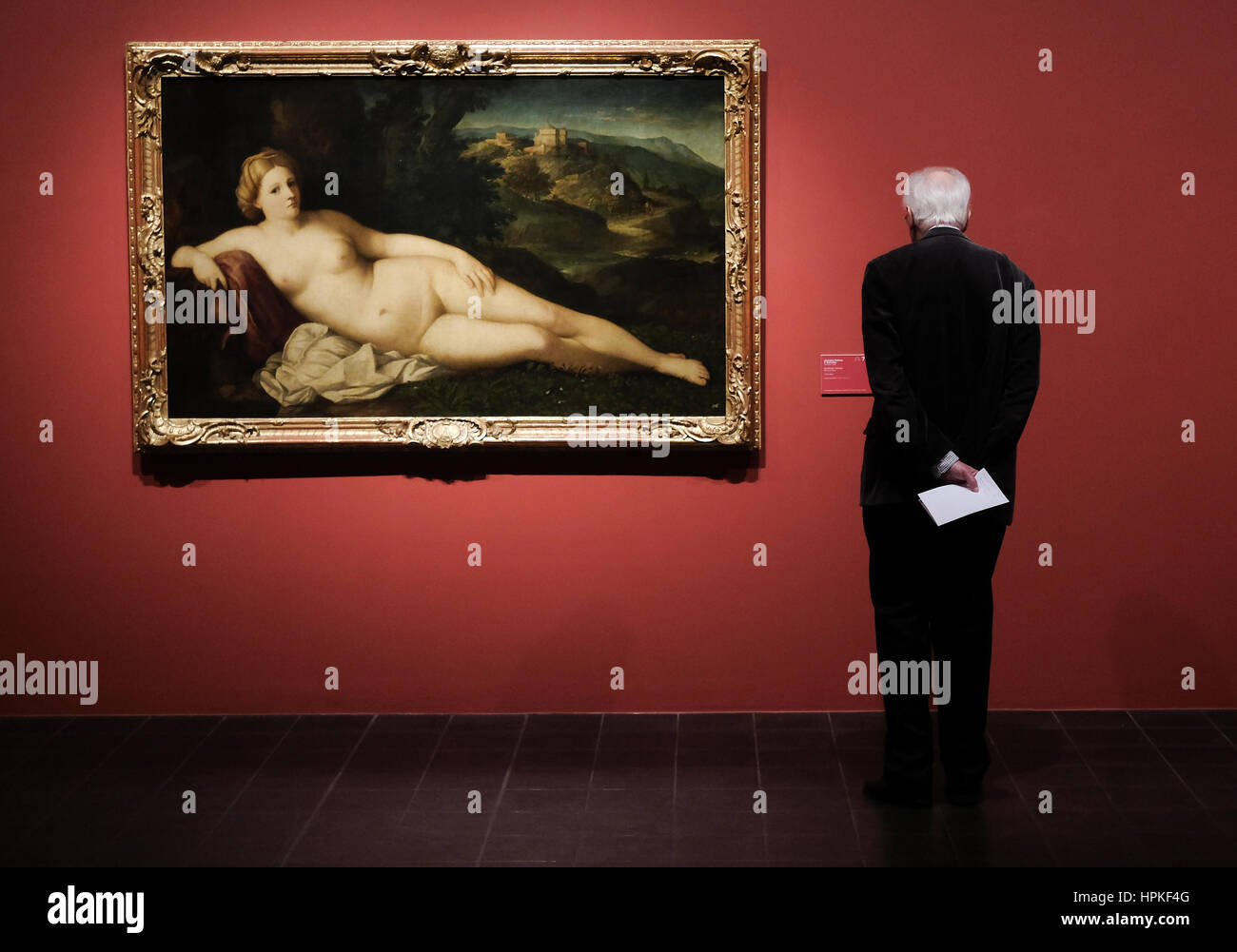 Hamburg, Germany. 23rd Feb, 2017. A man looks at works of art on display as part of an exhibition entitled 'The Poetry of Venetian Painting' in Hamburg, Germany, 23 February 2017. The exhibition will feature the work of artists such as Paris Bordone, Palma il Vecchio and Tizian. The show opens on the 24.02.17 and runs to the 21.05.17. Photo: Axel Heimken/dpa/Alamy Live News Stock Photo