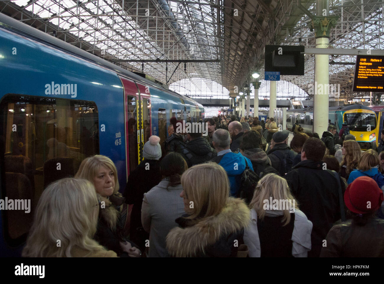 Manchester, UK. 23rd Feb, 2017. Storm Doris ‘Weather bomb' causes severe delays on all trains from Manchester Piccadilly rail station. Commuters warned of cancelled and delayed services as 'all lines are blocked' following 'overhead wire problems'. Departure boards shows severely delayed services. Credit: Bailey-Cooper Photography/Alamy Live News Stock Photo
