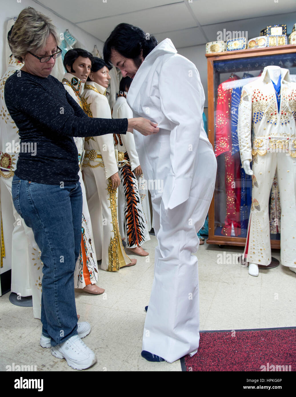 Charlestown, Indiana, USA. 23rd Feb, 2017. KIM POLSTON fits Elvis tribute  artist DAVE STOVALL for a new jumpsuit at B\u0026K Enterprises. In business  since 1980, B\u0026K manufactures Elvis Presley's original design jumpsuits, image size:1036x1390