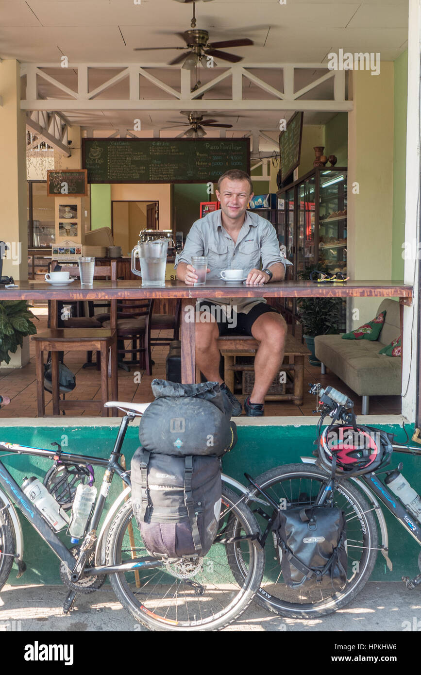 Bike tourist in a road side cafe, Cost Rica Stock Photo