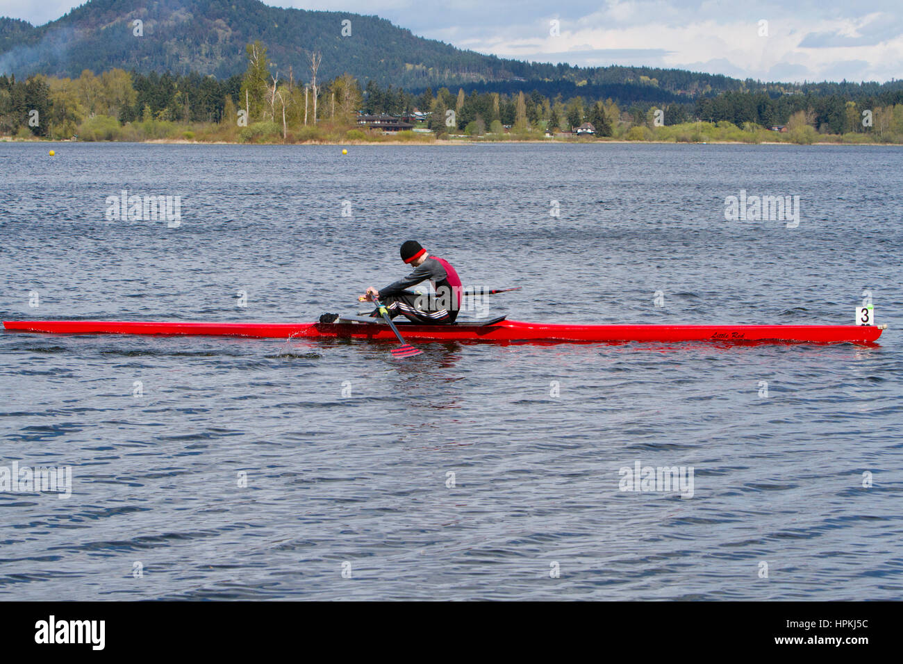 Teenage Rower A teenage rower sportsman, on a river in a singles rowing boat Stock ...