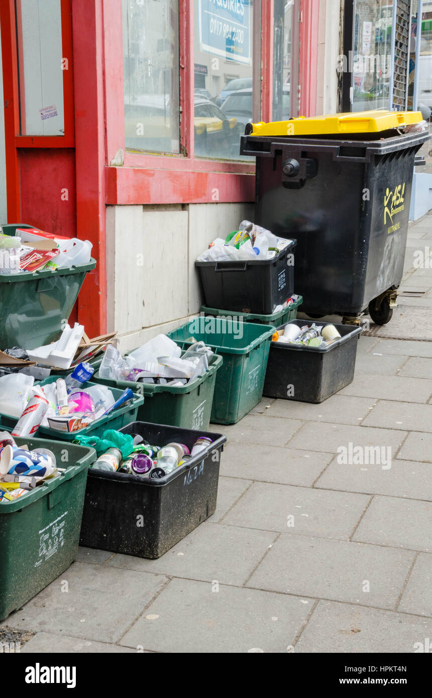 Recycling boxes for of rubbish left on the street for collection. Stock Photo