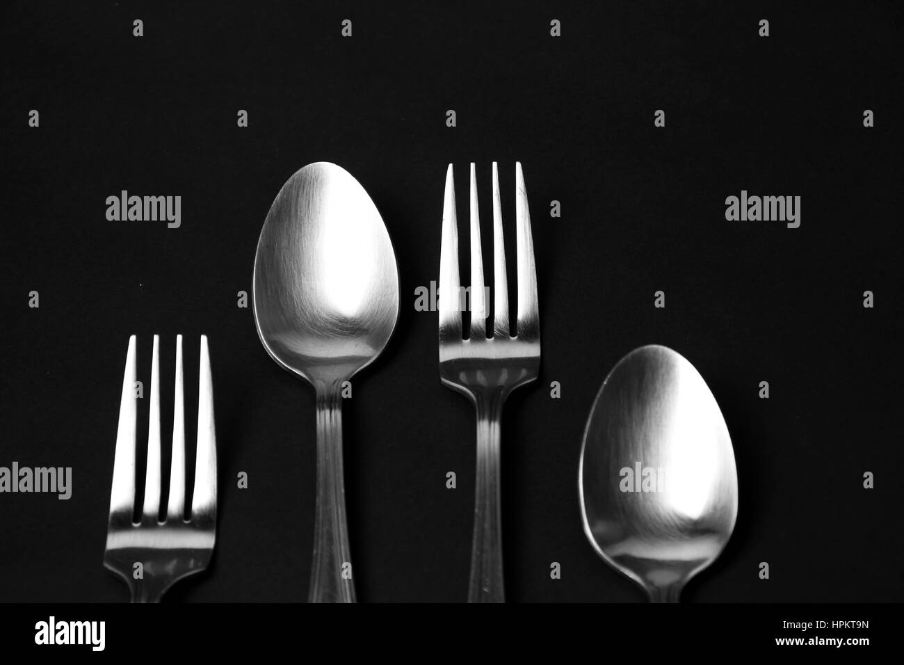 Fork and spoon background / spoons are the primary utensil used for