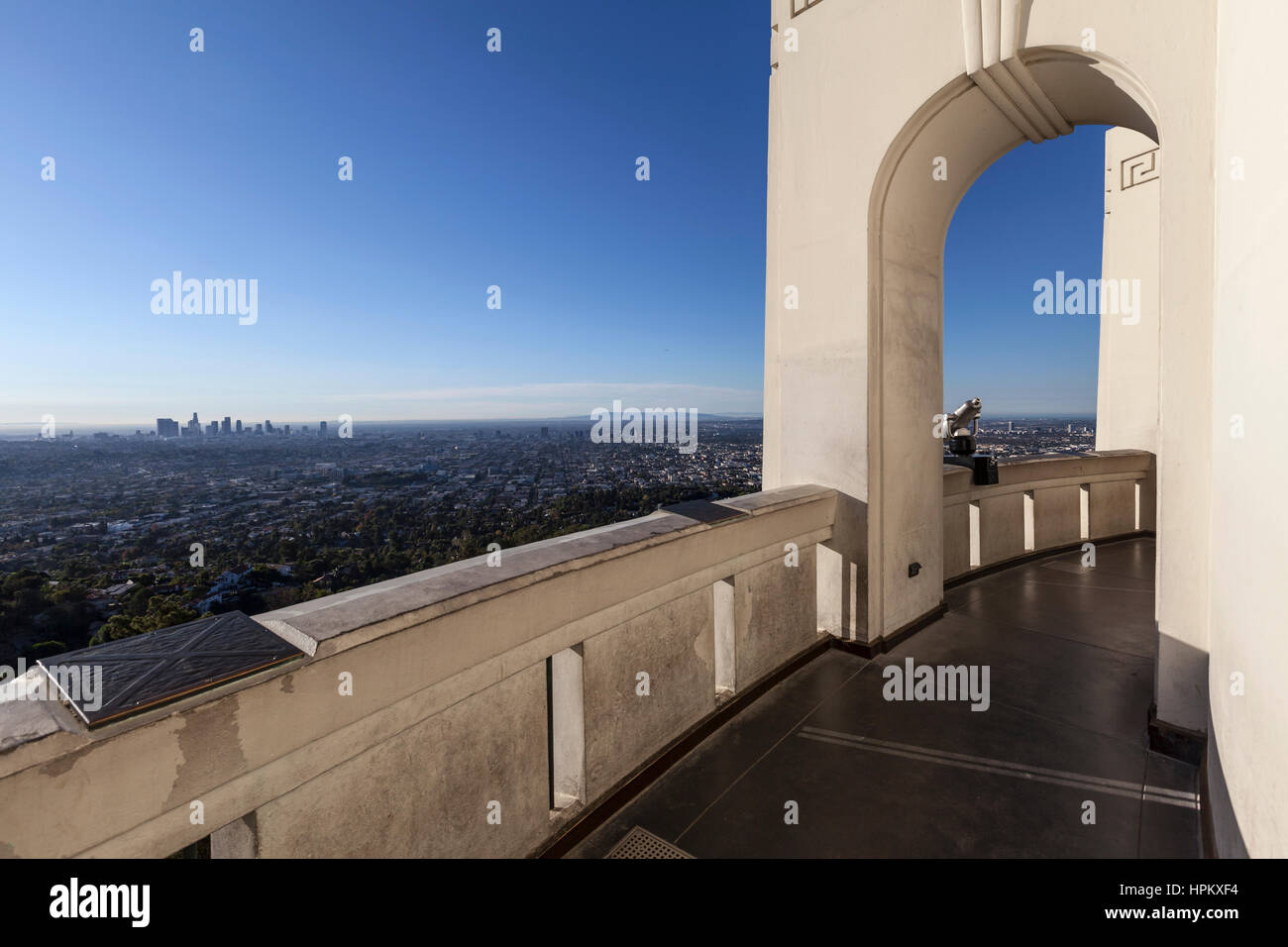 Los Angeles, California, USA - November 2, 2013:  Downtown skyline and arched walk way at LA's Griffith Park Observatory. Stock Photo