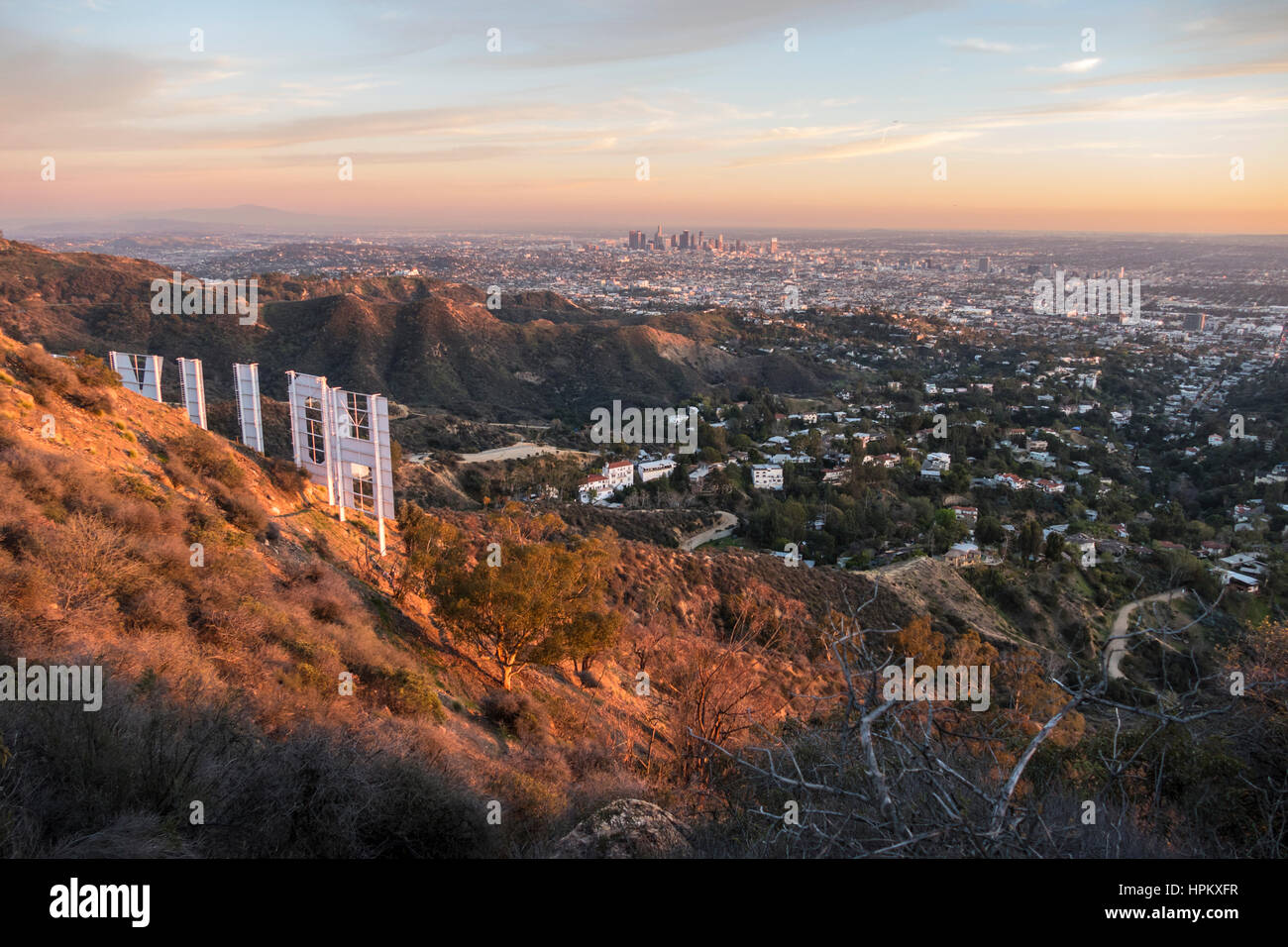 Los Angeles, California, USA - February 4, 2016:  Hollywood sign and downtown Los Angeles dusk cityscape view. Stock Photo