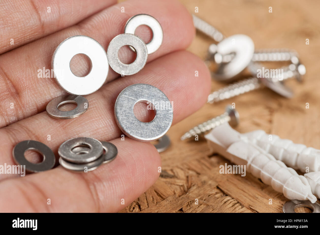 Closeup heap of pad screw washer in hand Stock Photo Alamy