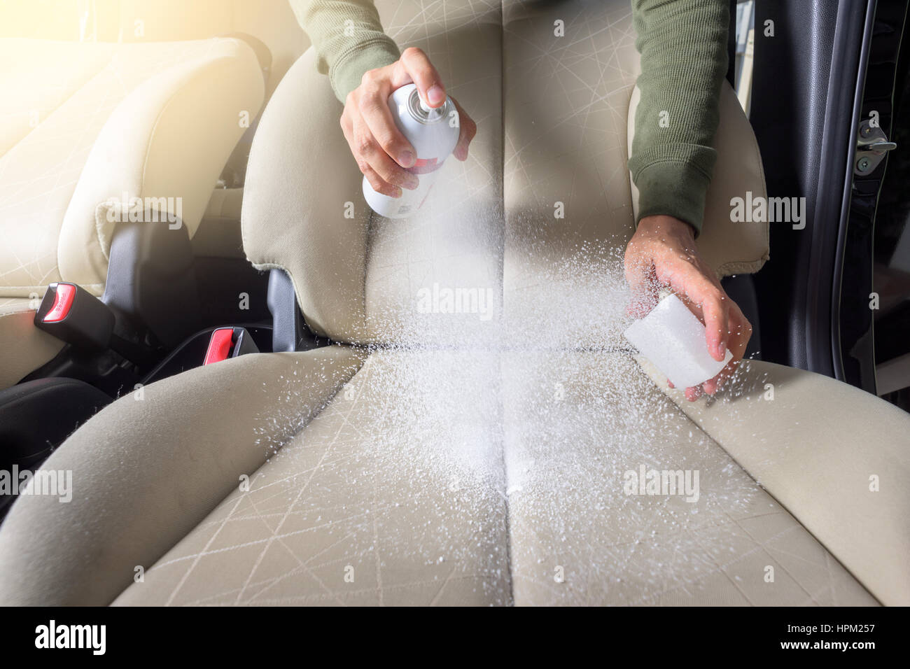 the man cleaning the car seat, car care concept Stock Photo