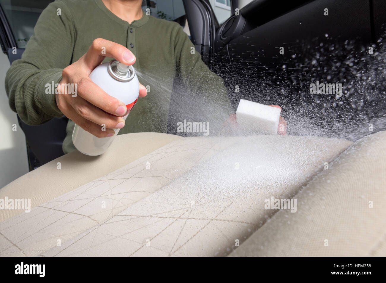 the man cleaning the car seat, car care concept Stock Photo