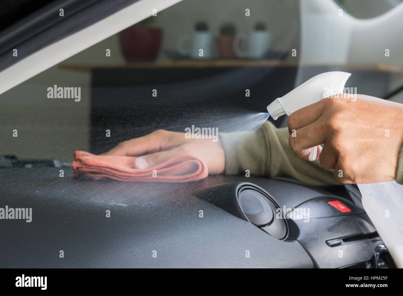 cleaning the car console with microfiber cloth Stock Photo - Alamy