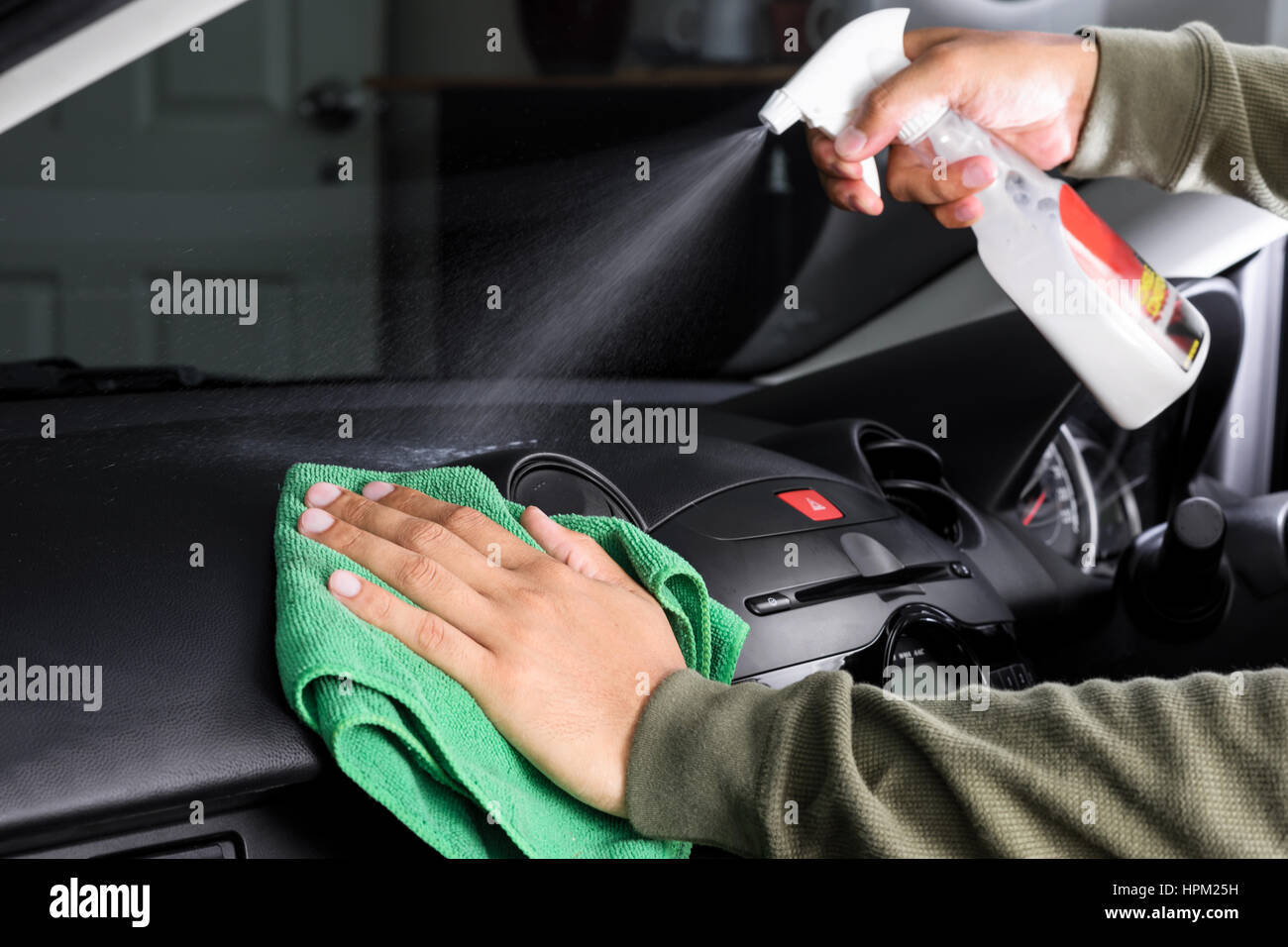 cleaning the car console with microfiber cloth Stock Photo - Alamy
