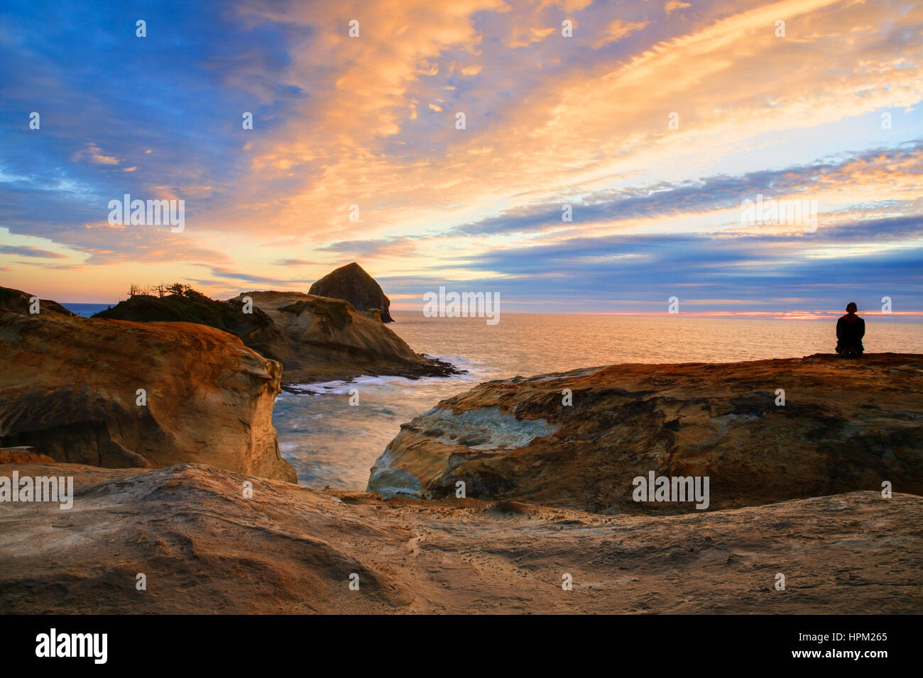 Man Enjoying the Sunset on the Cliffs of Cape Kiwanda in Pacific City