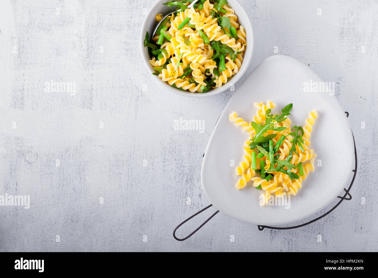 Pasta salad with asparagus and arugula Stock Photo Alamy