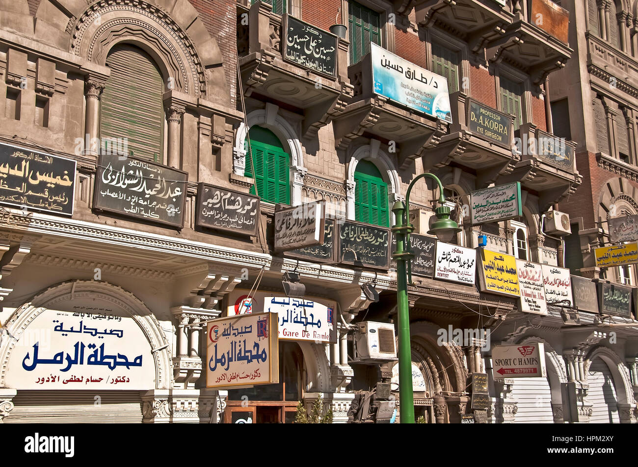 Downtown Alexandria street on the Corniche with numerous Arabic signs Stock Photo