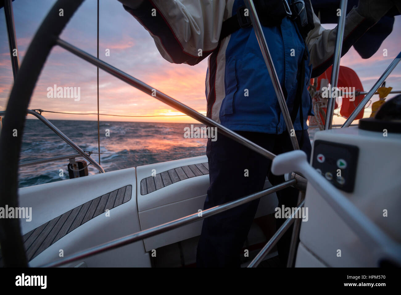 Male helmsman steering hi-res stock photography and images - Alamy