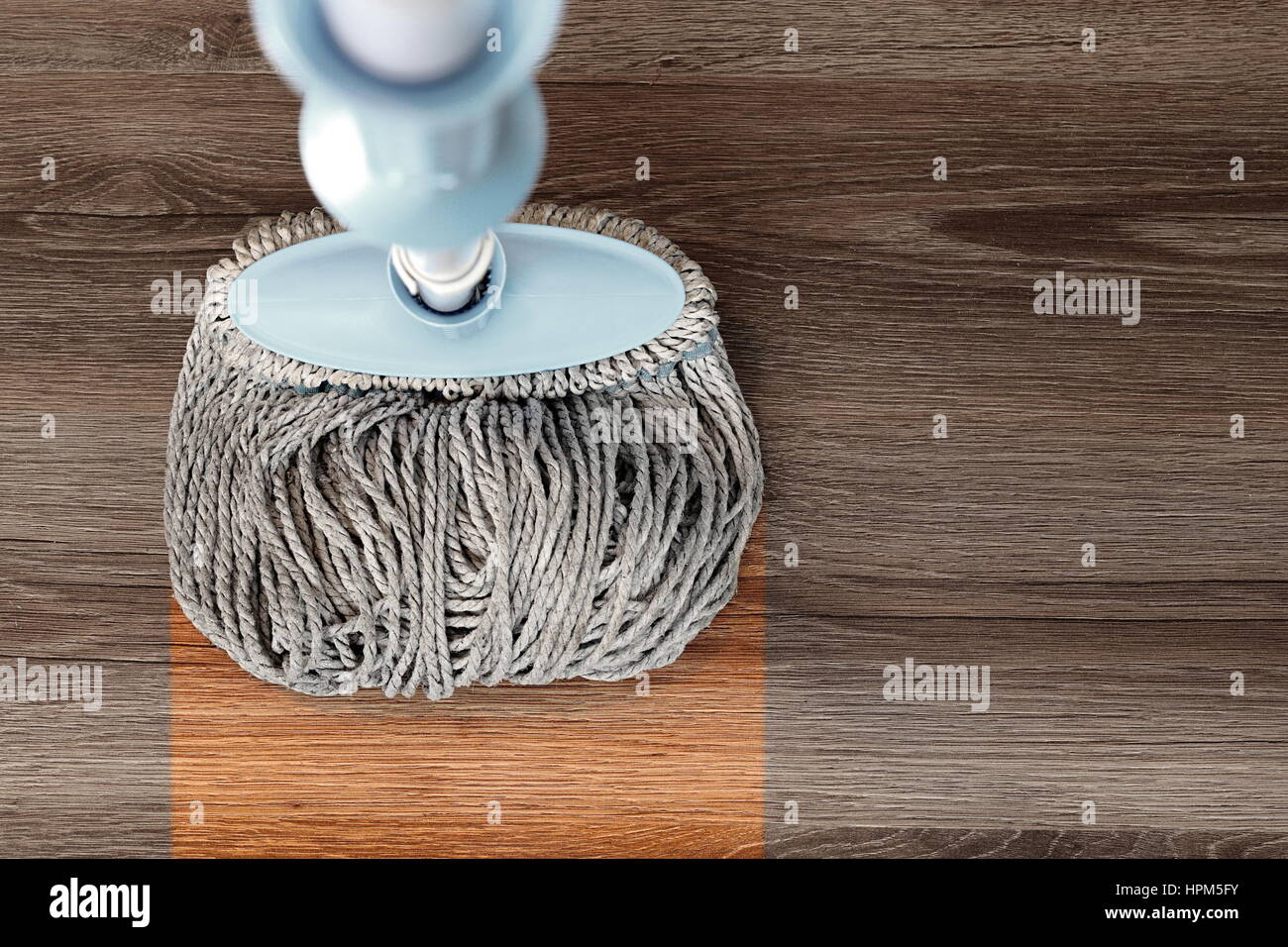 washing dirty wood floor with big mop Stock Photo Alamy