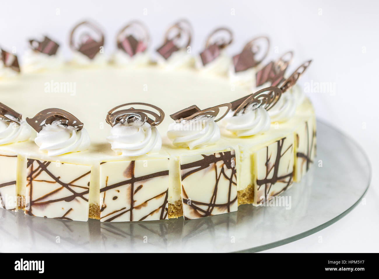White chocolate cake with chocolate decorations Isolated on white ...