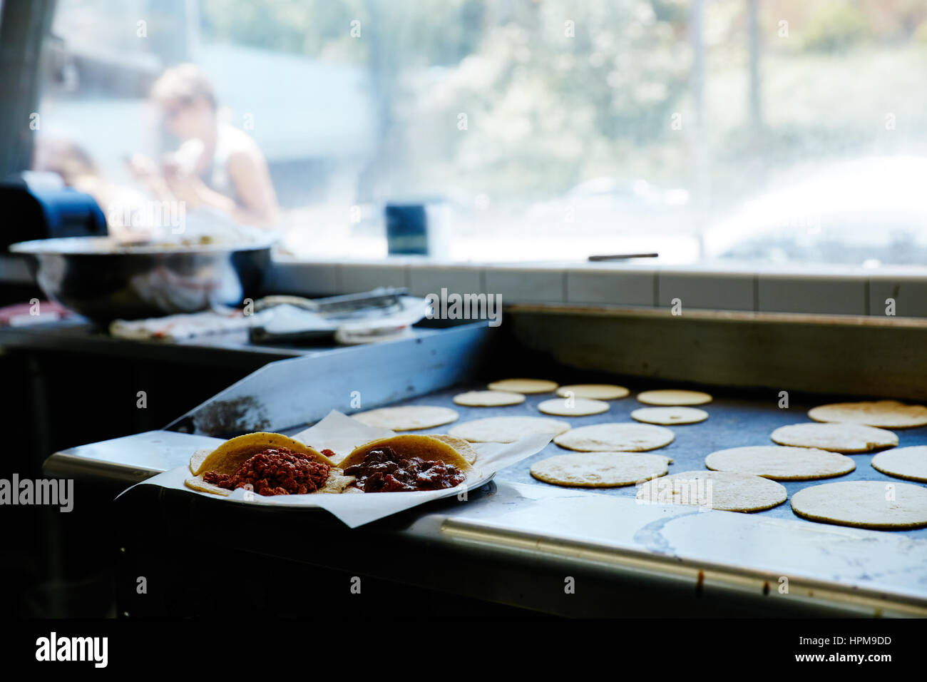 tortillas on flattop grill, tacos Stock Photo Alamy