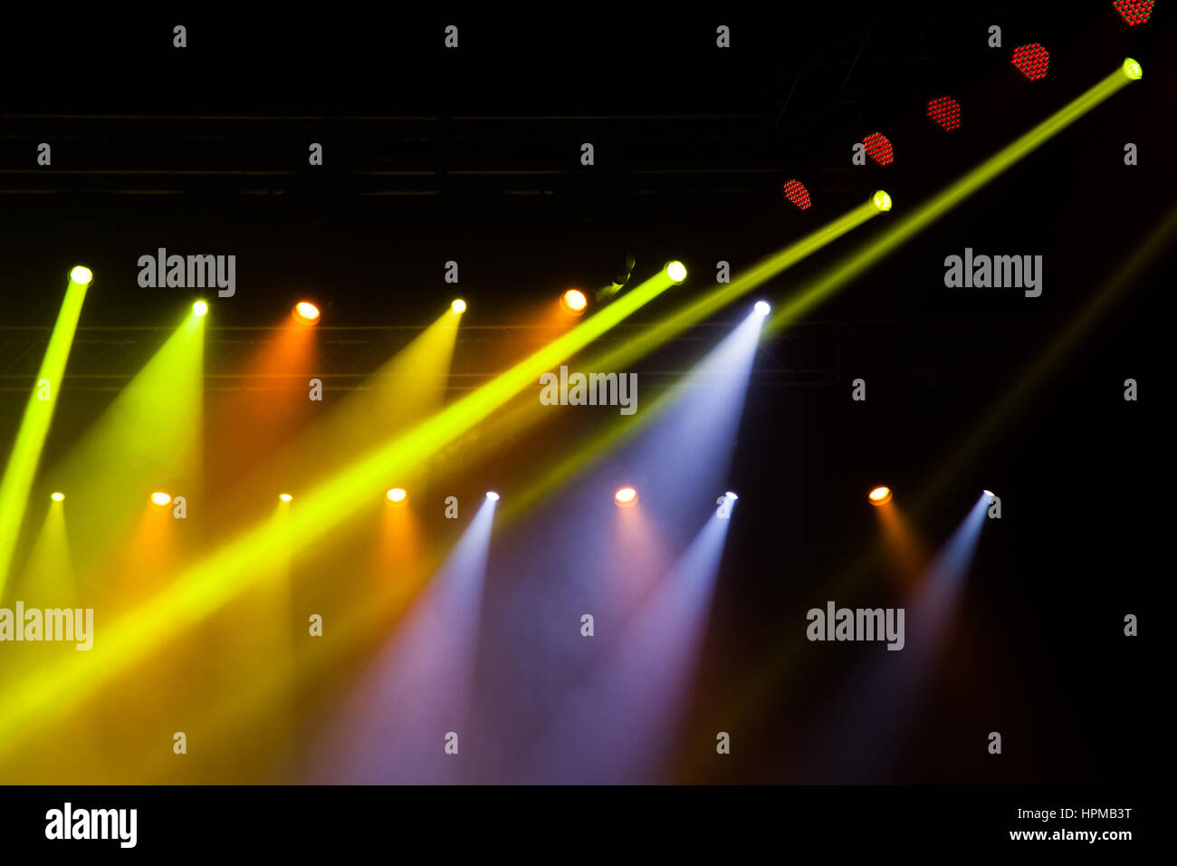 Stage lights on concert. Lighting equipment with multicolored beams