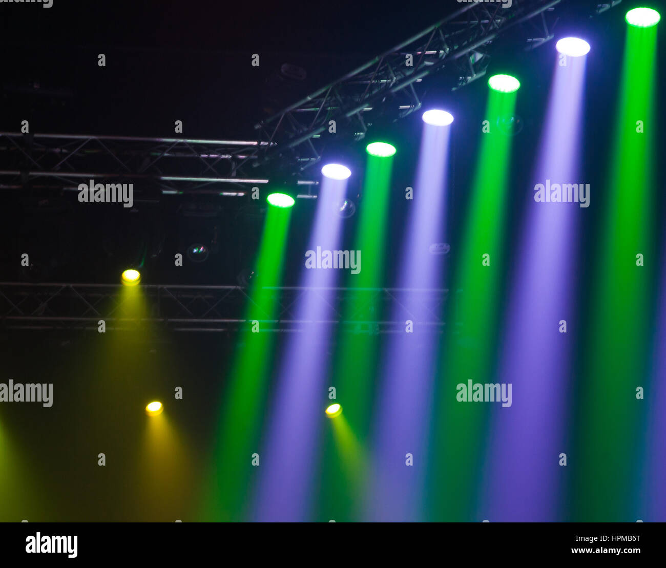Stage lights on concert. Lighting equipment with multicolored beams