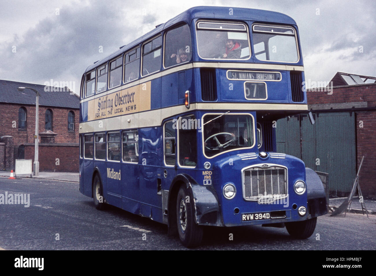 Scotland, UK - 1973: Vintage image of bus.  Eastern National  Lodekka MRD198 operated by Alexander Midland (registration number RVW 394D).  There are children making gestures from the top deck. Stock Photo
