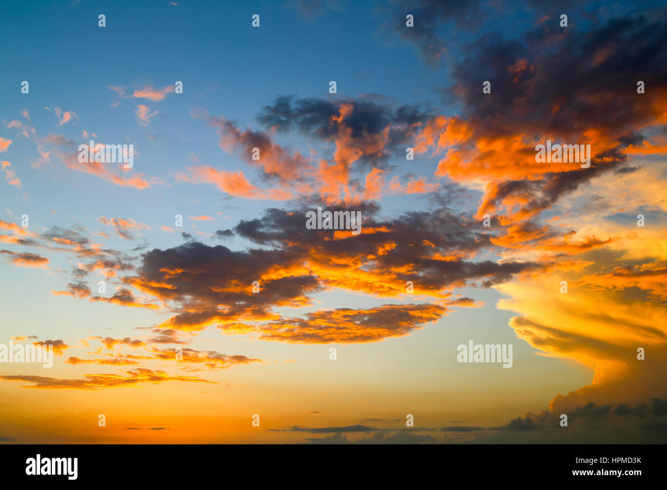 Clouds and sky illuminated by the setting sun Stock Photo - Alamy
