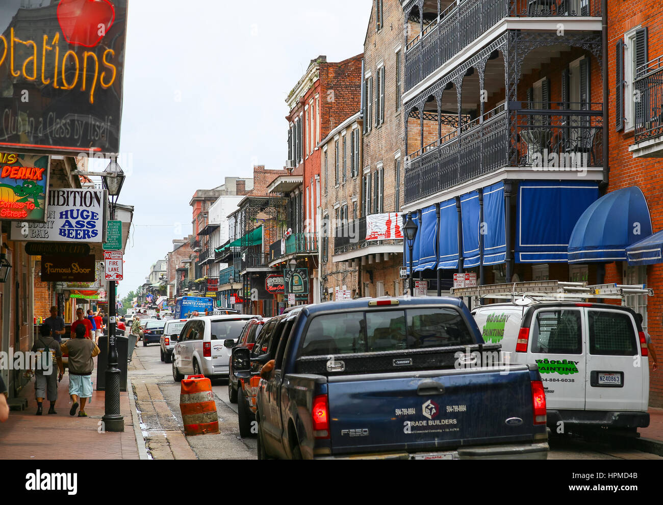 New Orleans, USA May 14, 2015 Cars driving and people strolling down