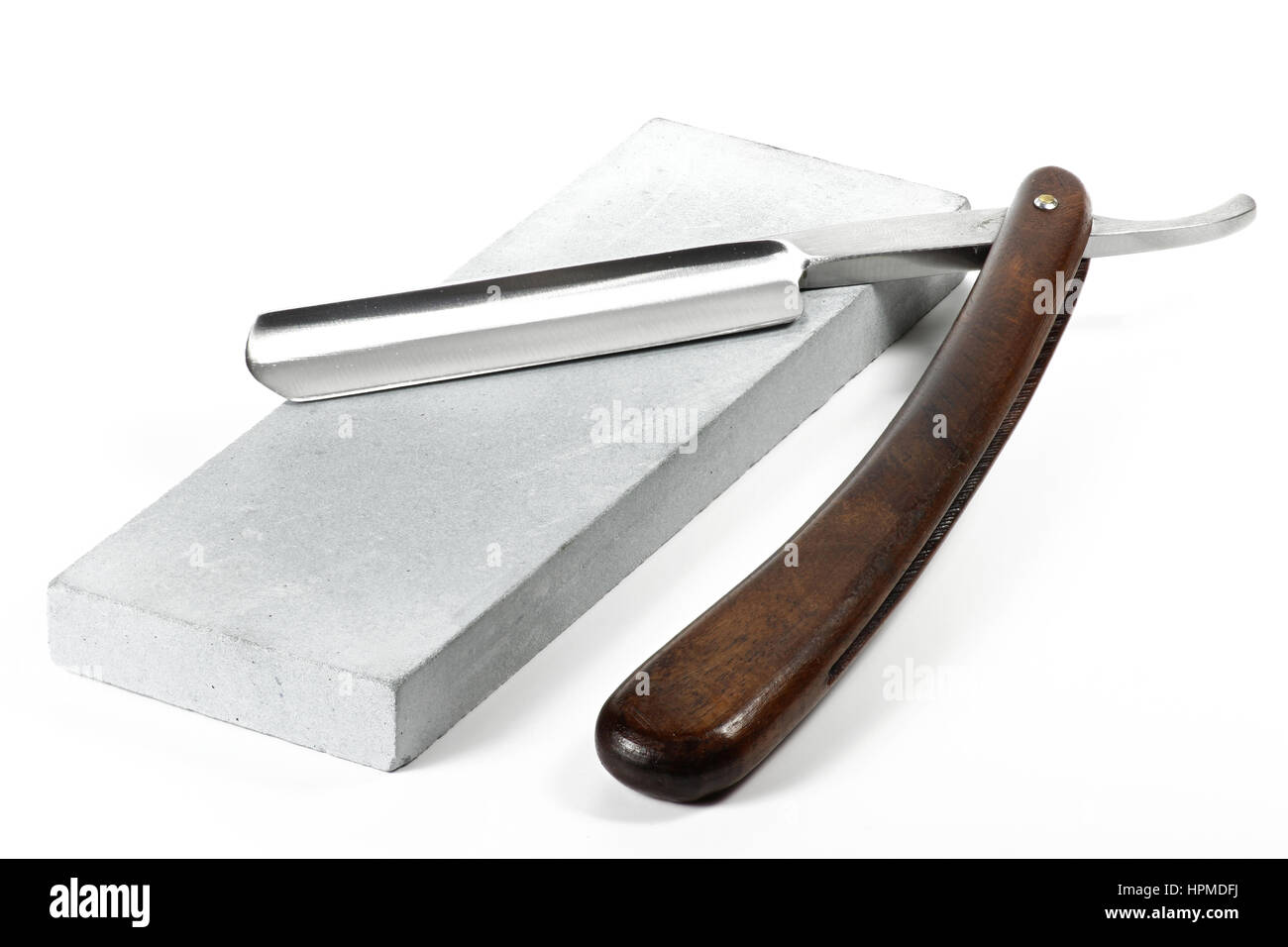 straight razor with honing stone isolated on white background Stock Photo Alamy
