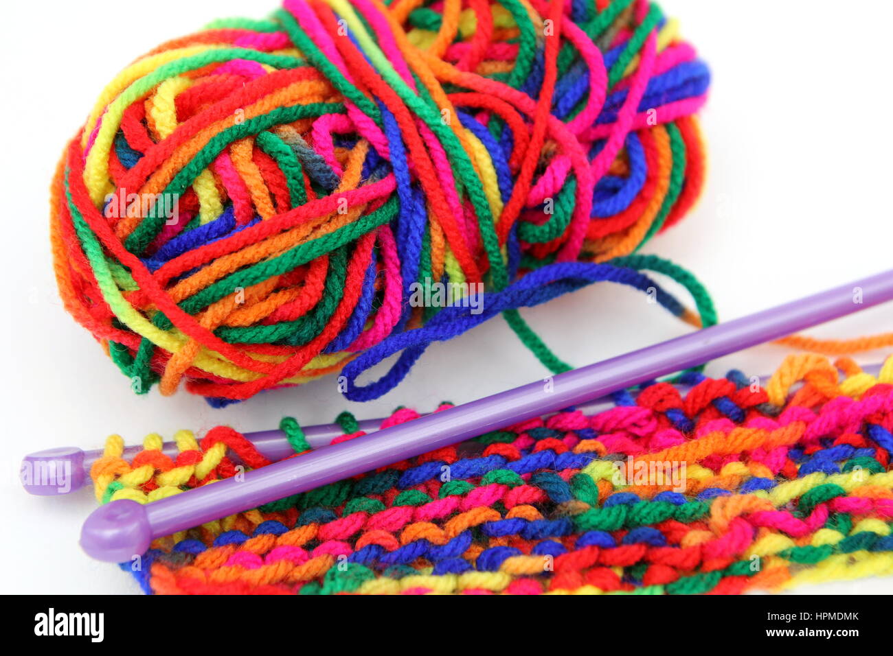 Knitting with multi colored yarn with orange, red, and yellow tones Stock  Photo - Alamy