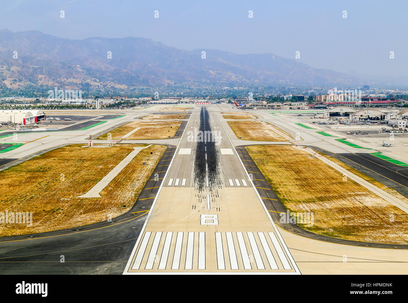 Burbank, USA - May 27, 2015: Aerial view of the airport with runways, hangars and parked airplanes. Stock Photo