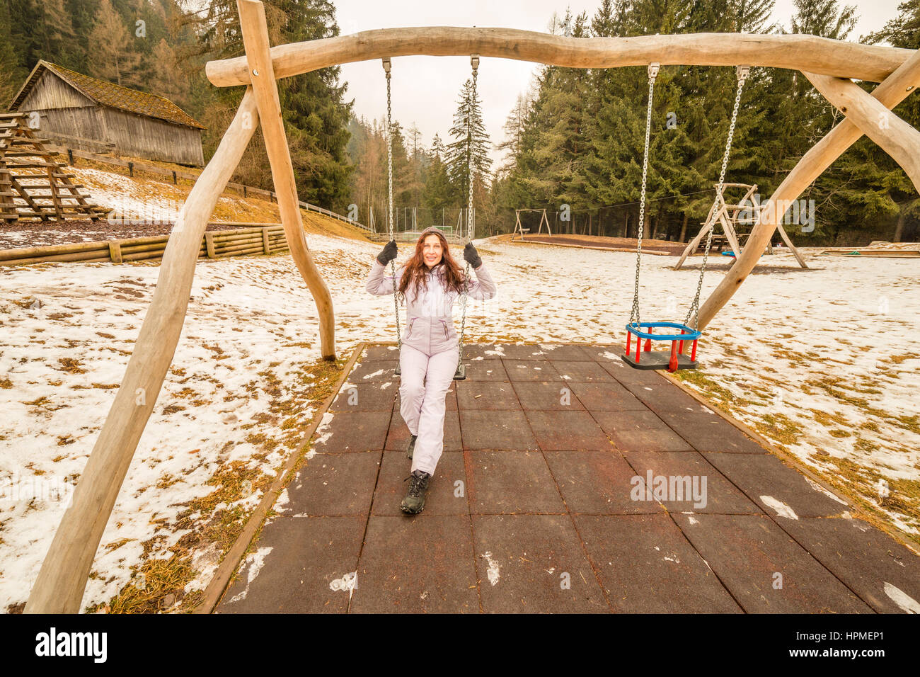 Mature woman on swing park hi-res stock photography and images - Alamy