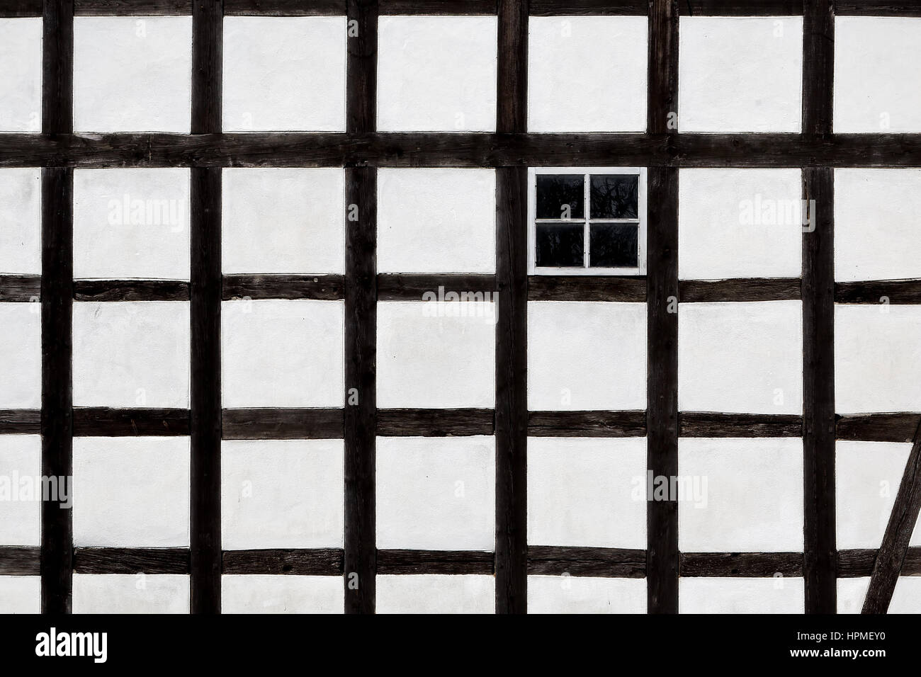 The wall and window of an old farmhouse Stock Photo