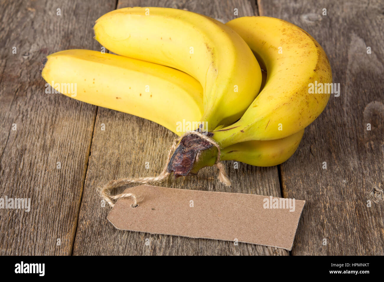 Bunch of bananas with blank price tag Stock Photo Alamy