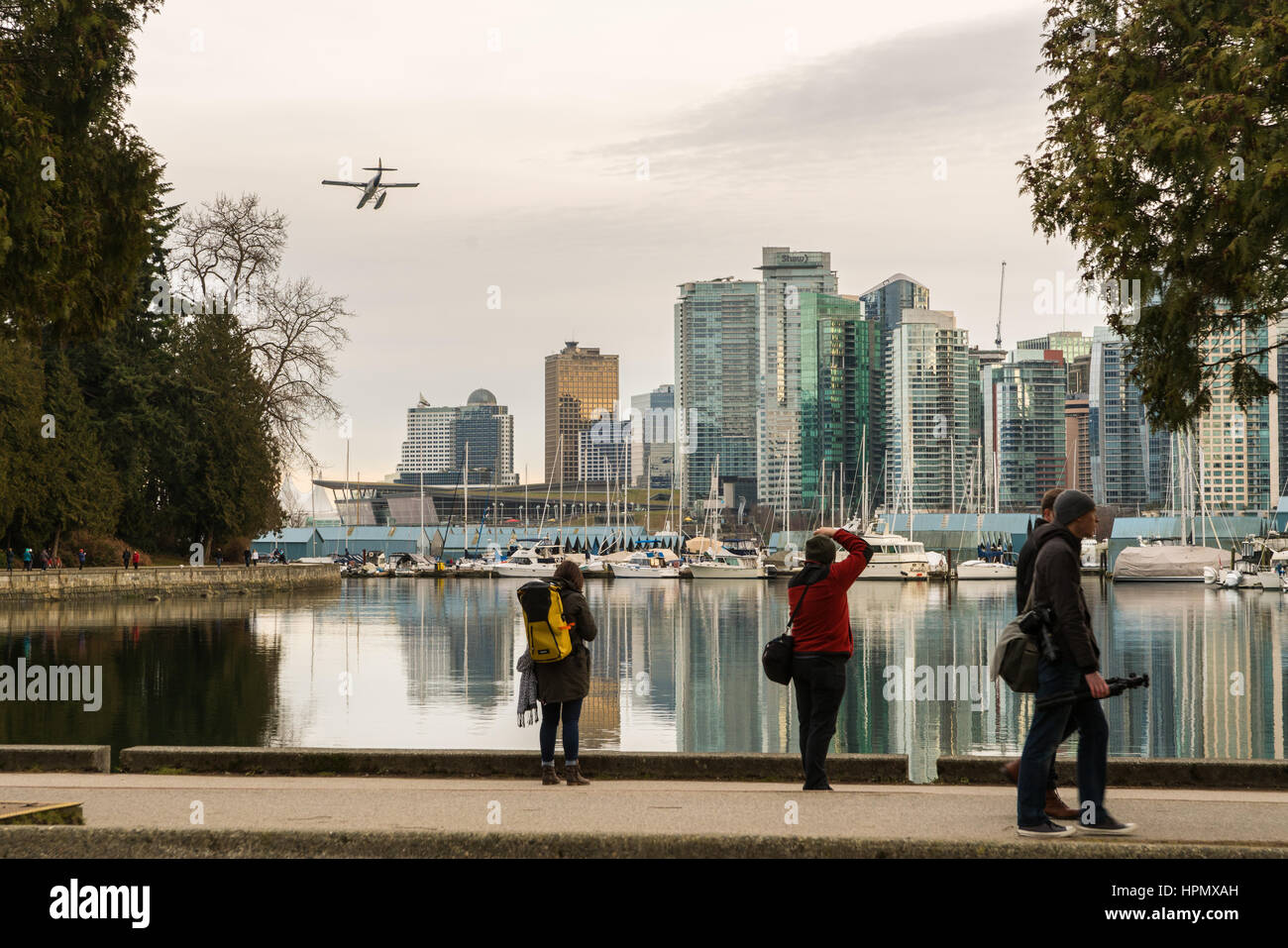 Vancouver city skyline with boats in harbour and seaplane coming in to land Stock Photo