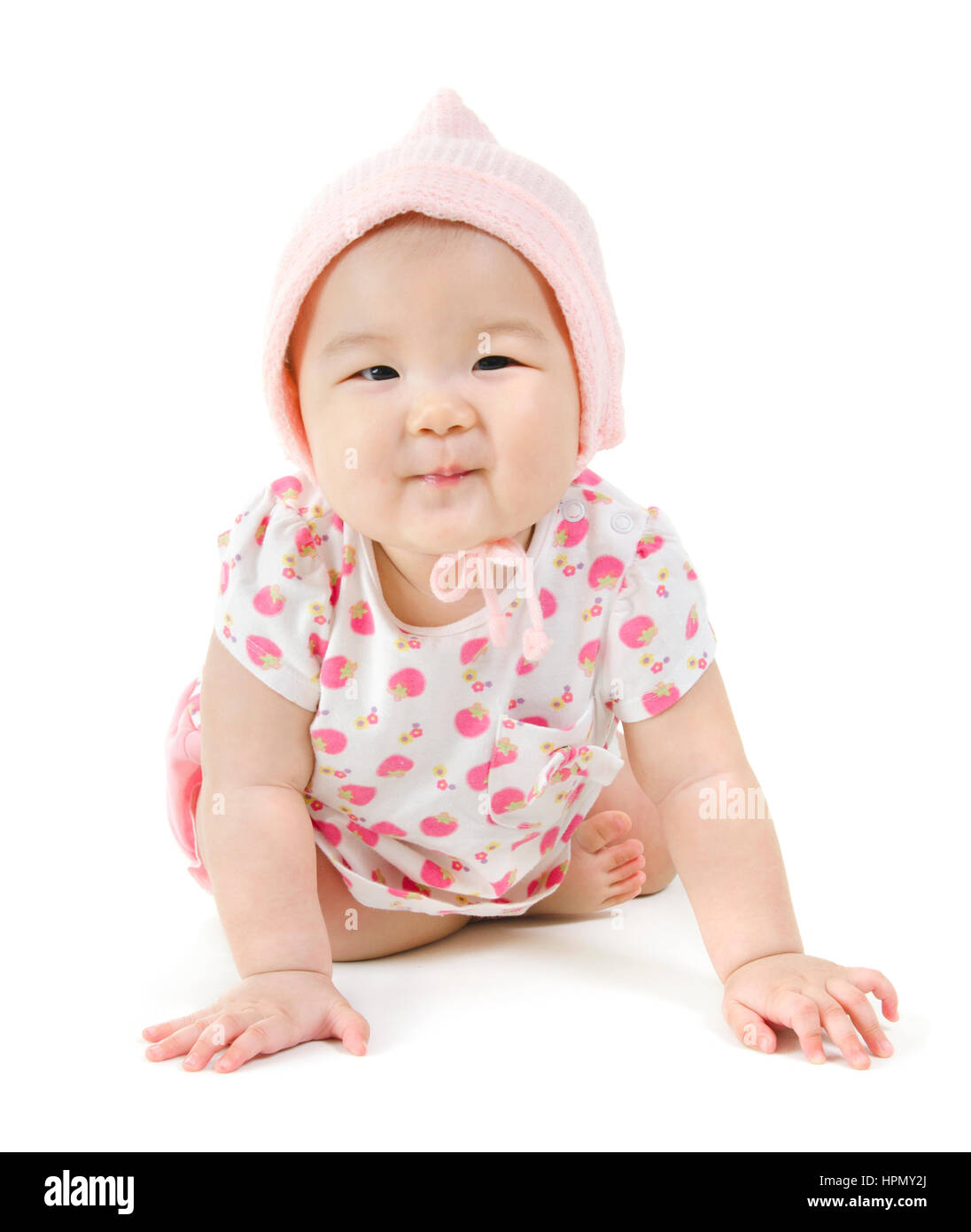 Portrait of full length happy Asian baby girl in pink clothes crawling
