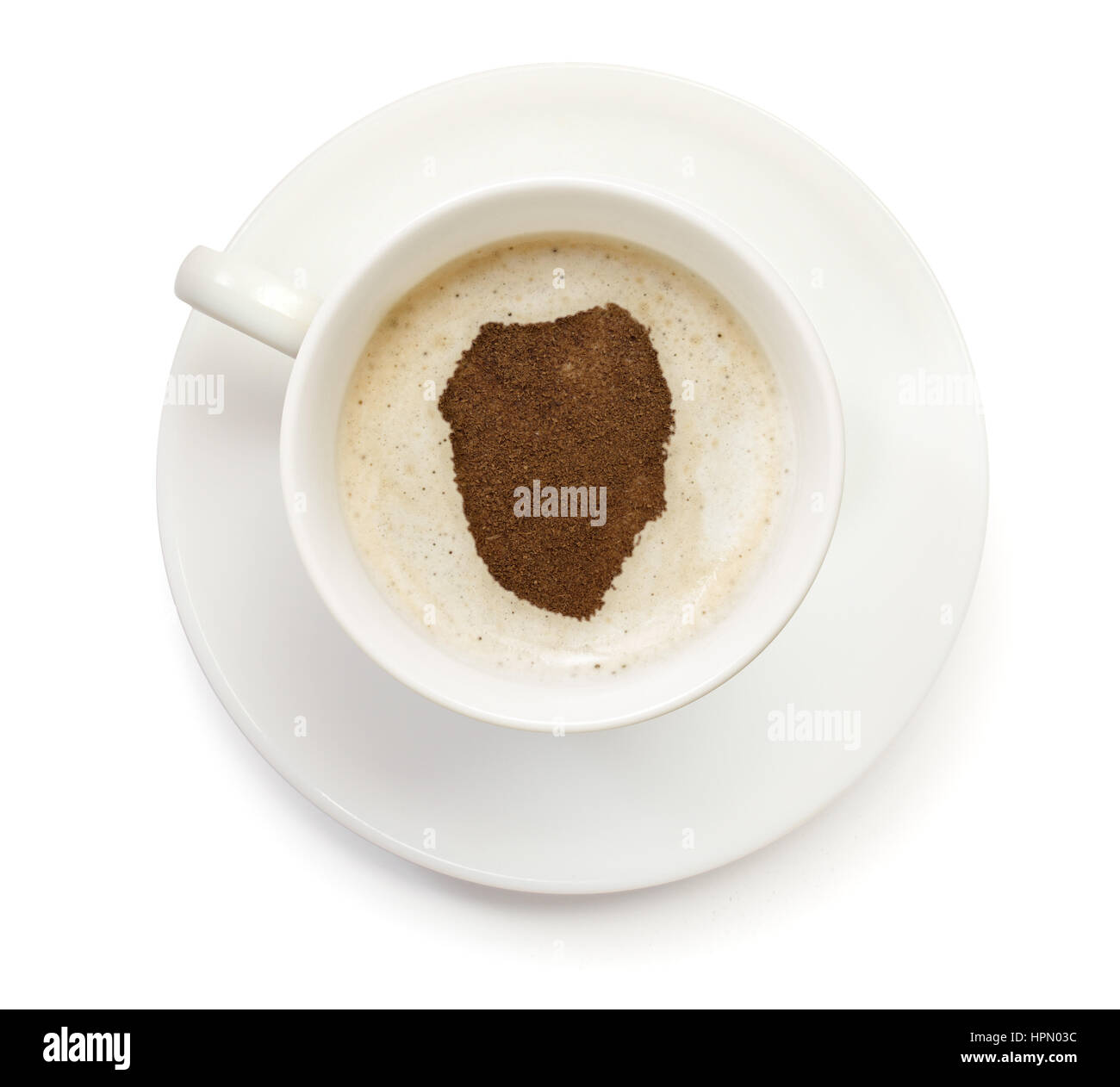 A cup of coffee with foam and powder in the shape of Sierra Leone.(series) Stock Photo