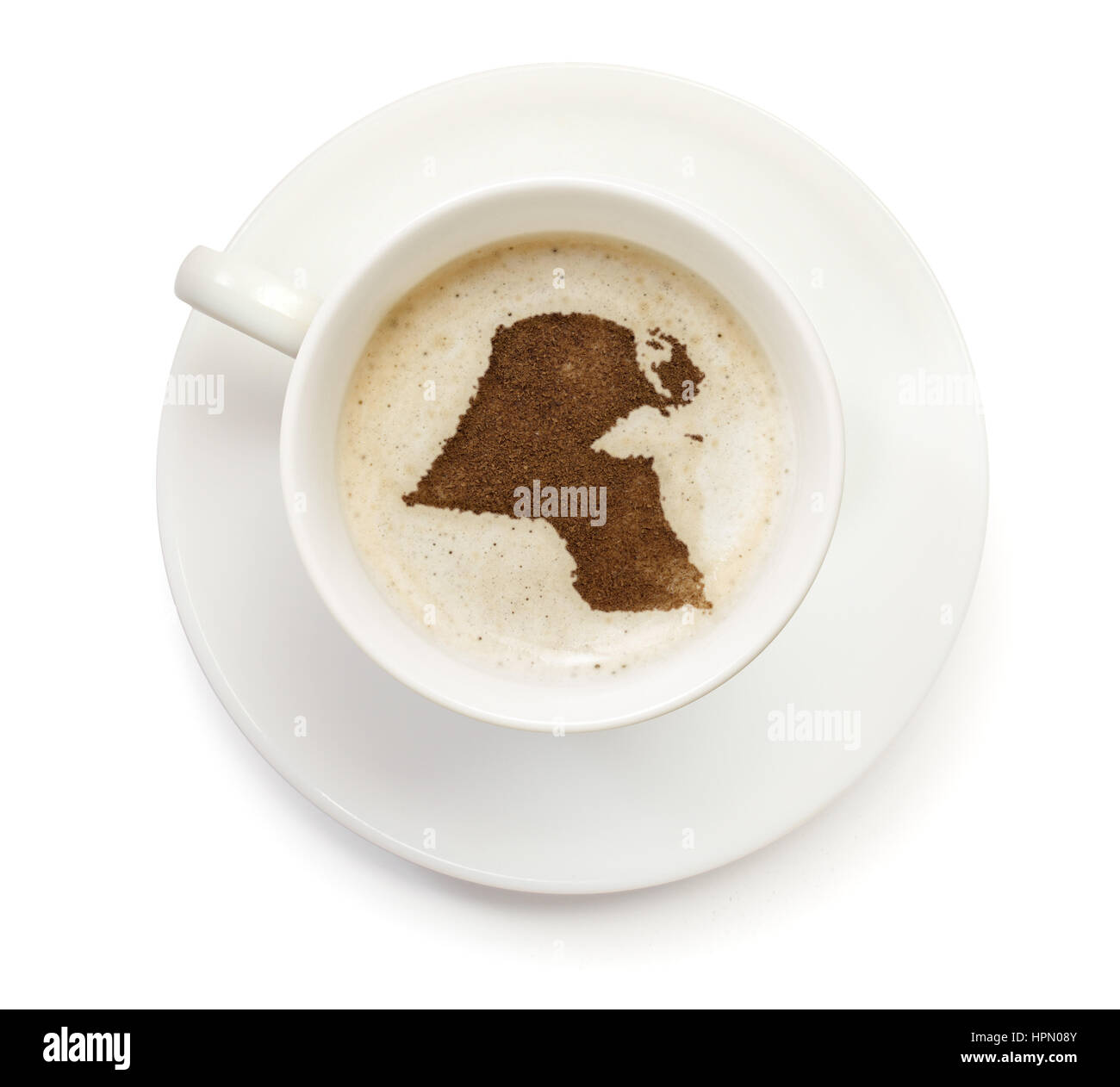 A cup of coffee with foam and powder in the shape of Kuwait.(series) Stock Photo