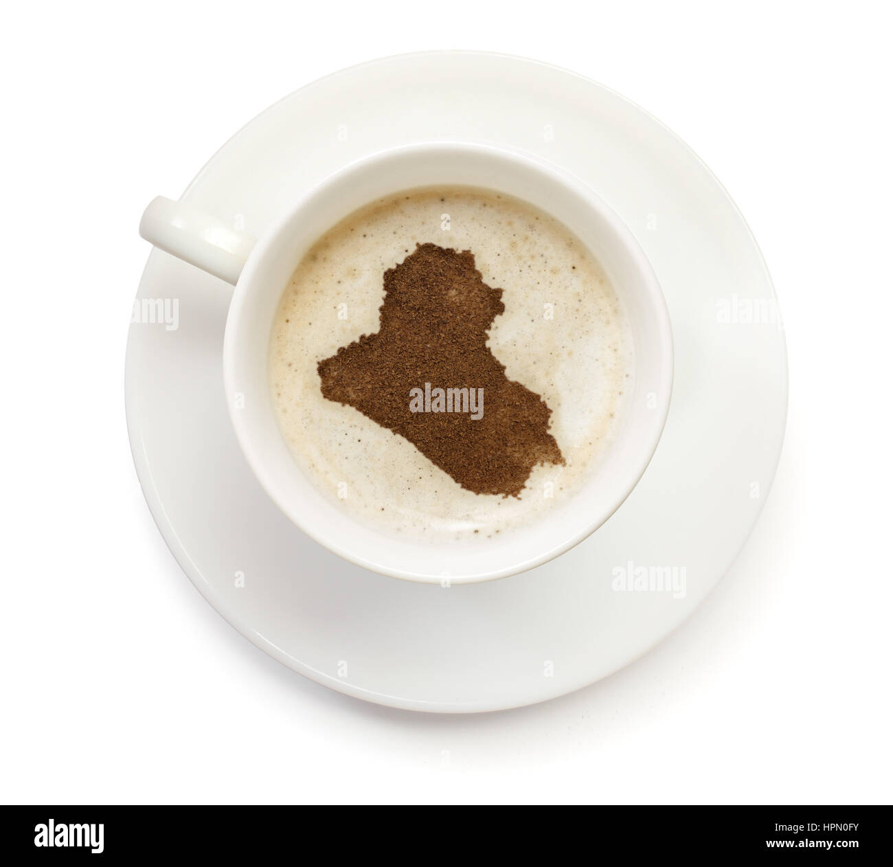 A cup of coffee with foam and powder in the shape of Iraq.(series Stock Photo Alamy
