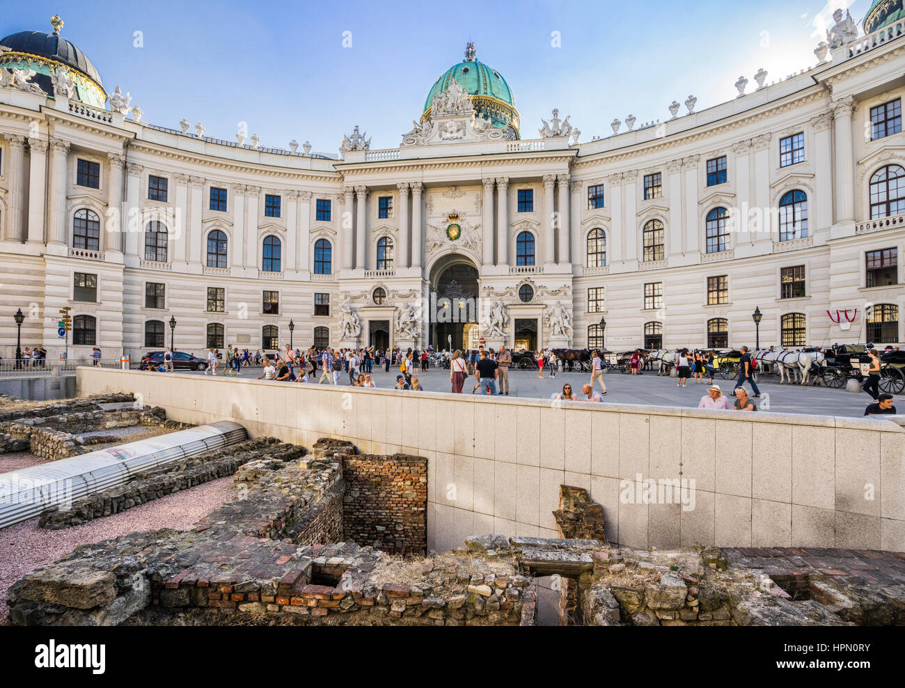 Austria, Vienna, Michaelerplatz, archaeological remains of the Roman outpost Vindobona at Michaelerplatz against backdrop of the Vienna Hofburg Stock Photo