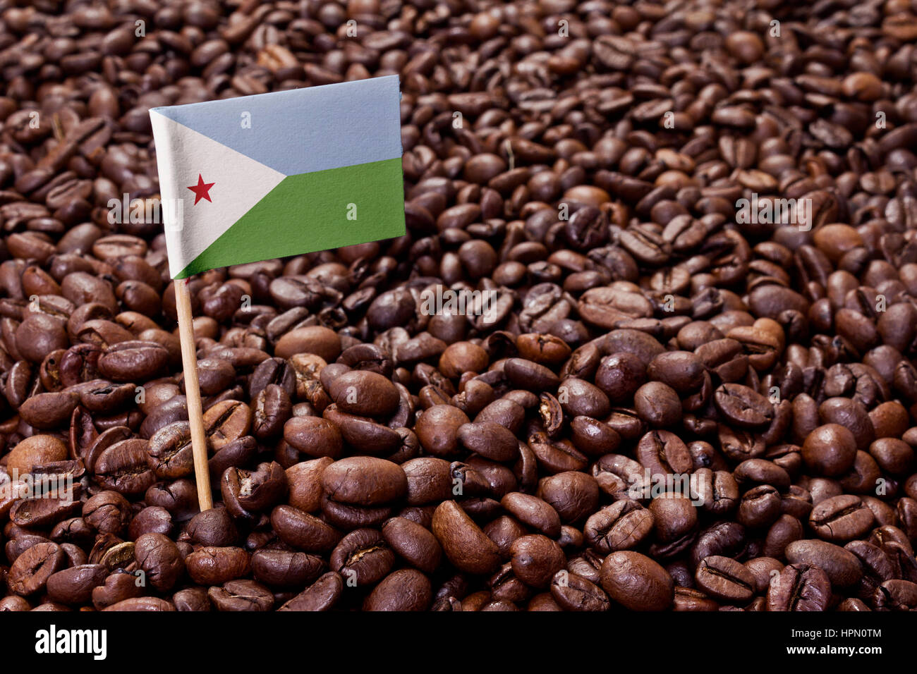 Flag of Djibouti sticking in roasted coffee beans.(series Stock Photo