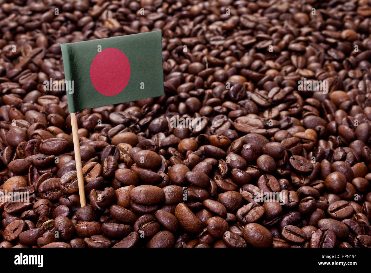 Flag of Bangladesh sticking in roasted coffee beans.(series Stock Photo