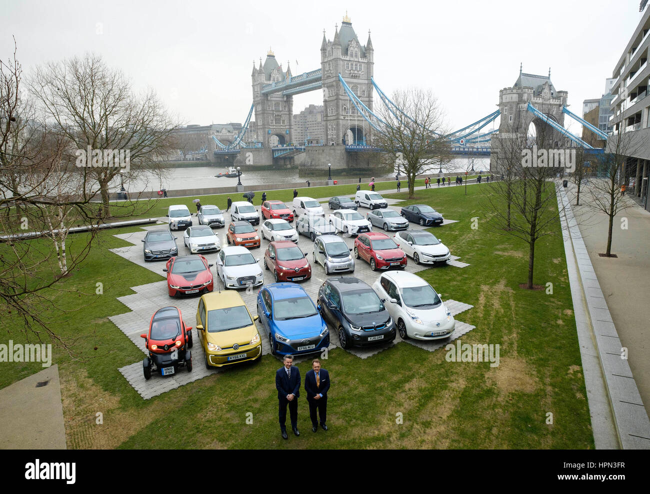 Mike Hawes, Chief Executive of The Society of Motor Manufacturers and Traders (left), and transport Minister John Hayes MP with (left to right), Renault Twizy, Volkswagen e-Up!, Hyundai IONIQ Electric, BMW i3 and Nissan LEAF, 5 of 26 Alternatively Fuelled Vehicles (AFVs) on display at Potters Fields Park in London to highlight the automotive industry aim to deliver the latest in clean air technology for towns and cities across the UK. Stock Photo