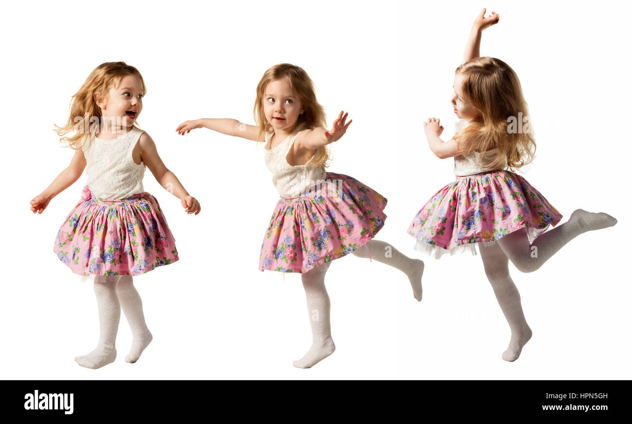 Cute three-year girl jumping with joy isolated on white background Stock Photo