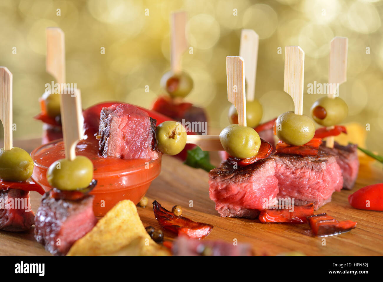 Medium fried steak tapas with chili, peppers and hot dip sauce Stock