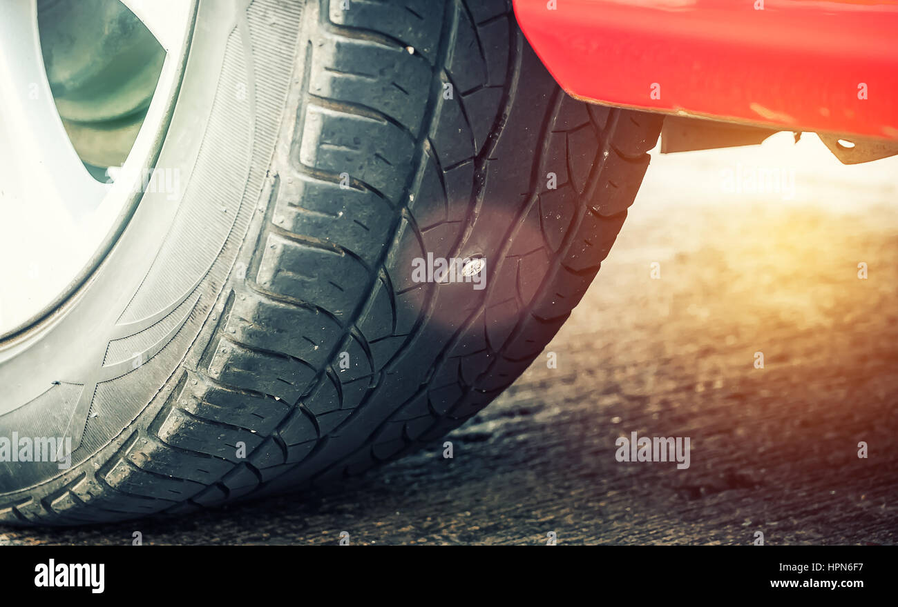 Screw punctured car tire Stock Photo Alamy