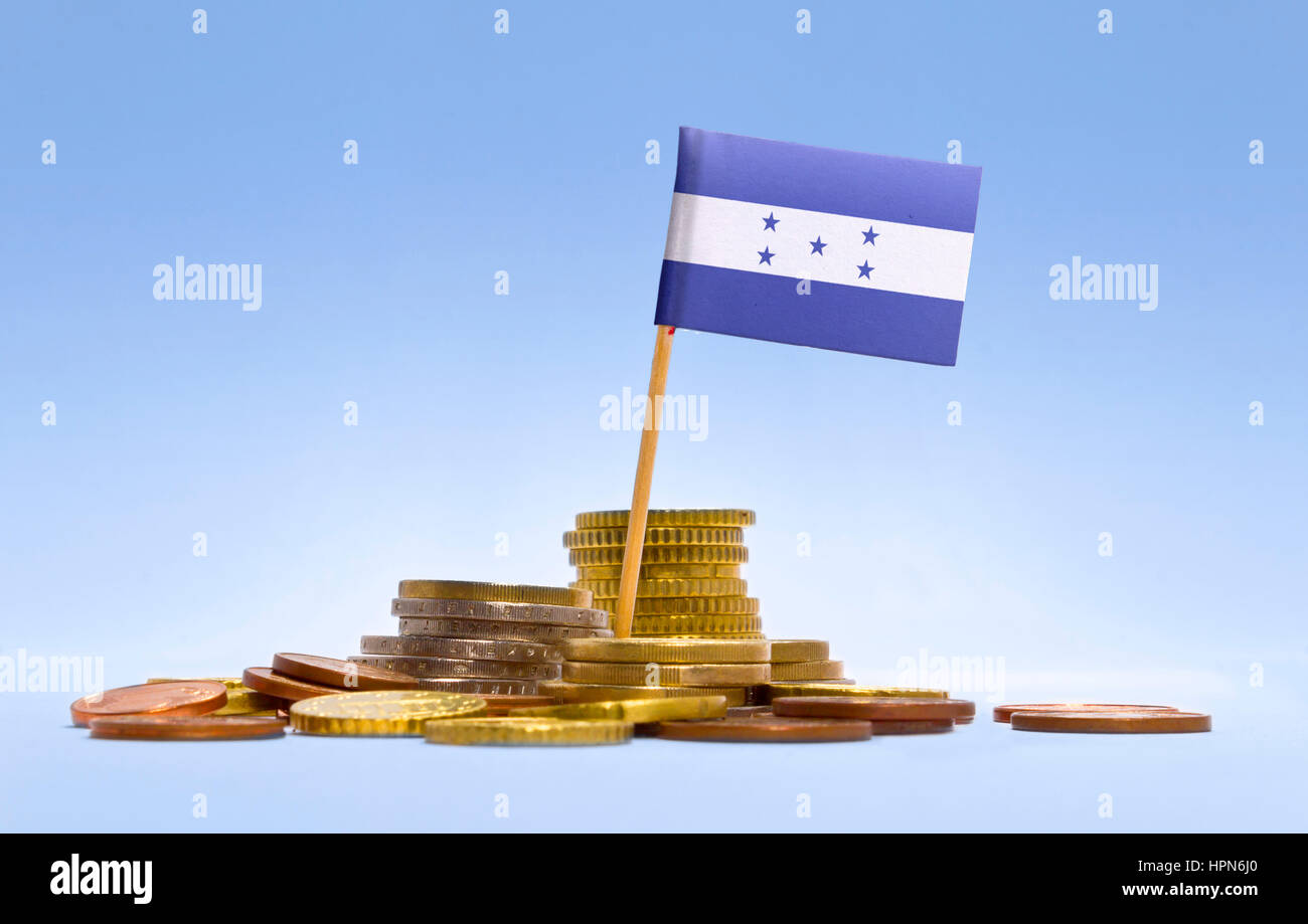 Flag of Honduras in a mixed stack of european coins and a blue background.(series) Stock Photo