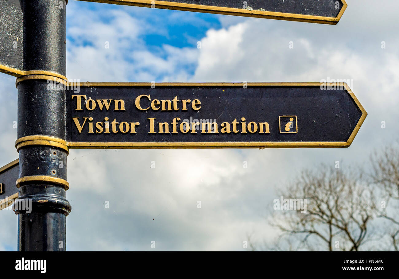 Town centre and visitor information sign post in market town of Thirsk, North Yorkshire, UK. Stock Photo