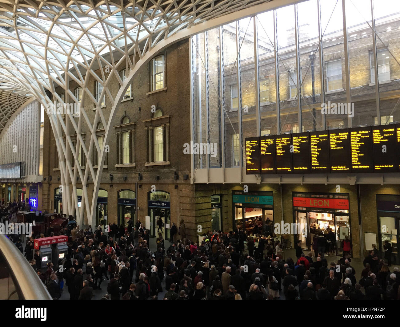 Commuters waiting at King's Cross Station in London, as flights have