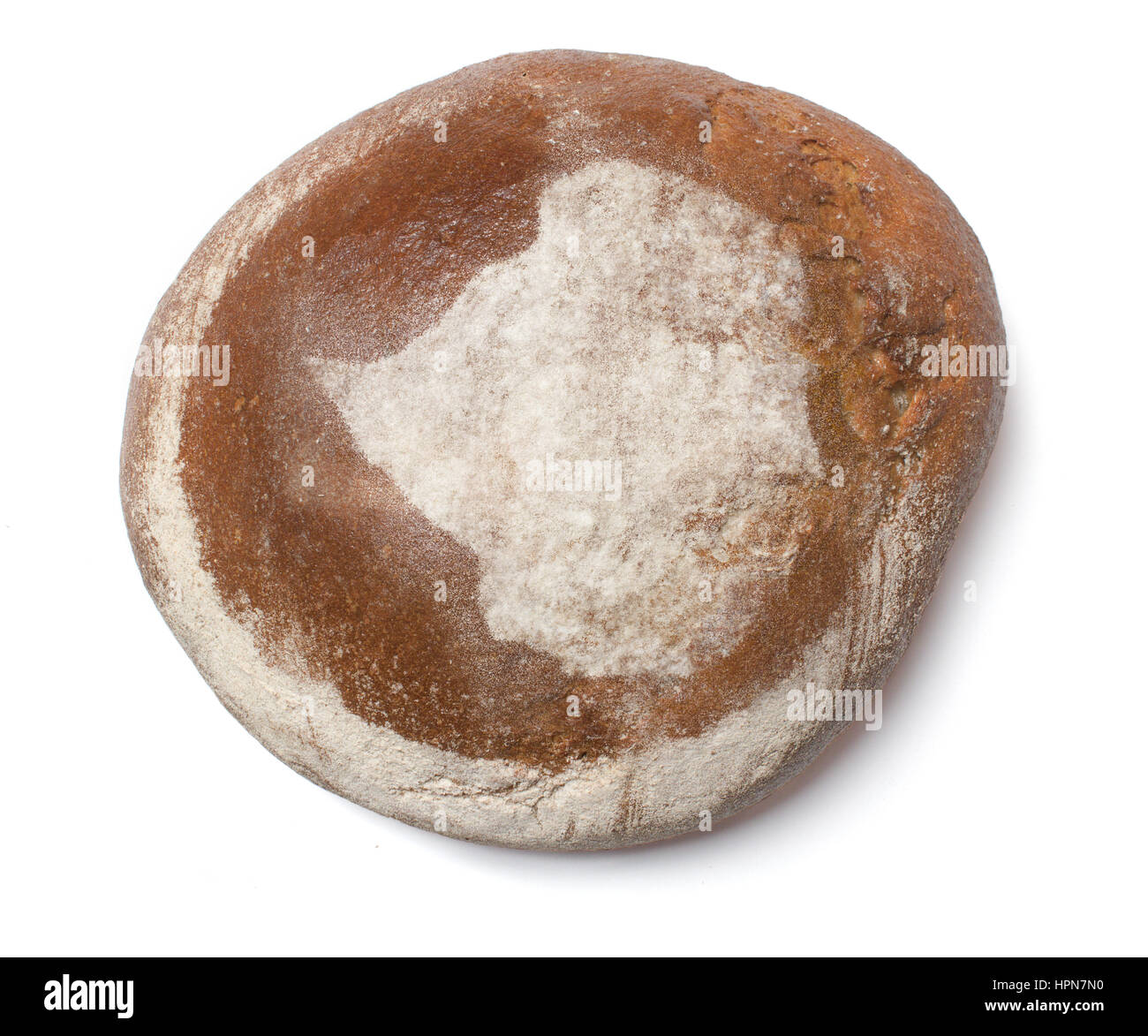 A freshly baked loaf of bread covered with rye flour in the shape of