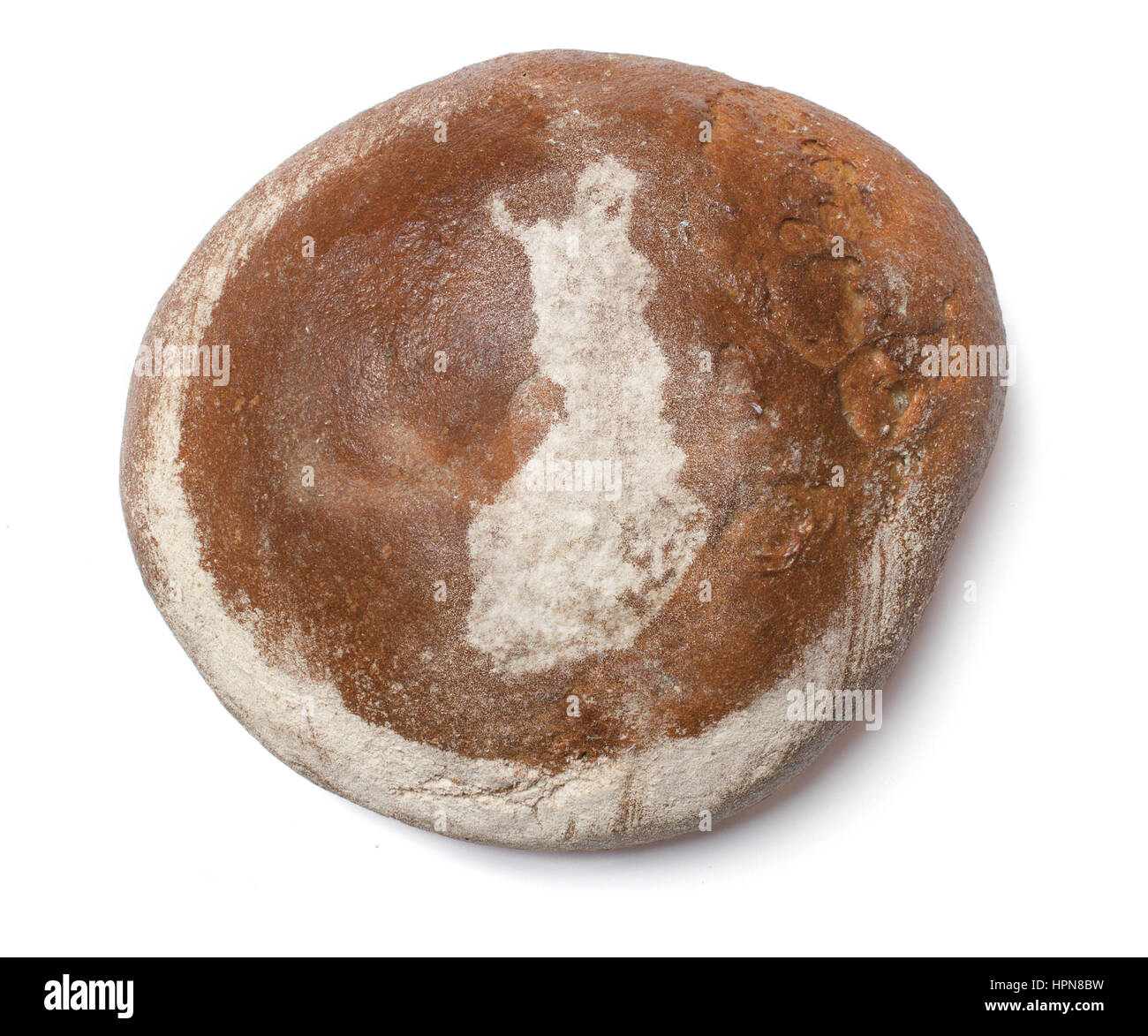 A freshly baked loaf of bread covered with rye flour in the shape of Finland.(series) Stock Photo
